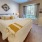a bedroom with a bed and lamps